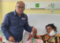 Head of the Papua Representative Office of the National Human Rights Commission while meeting Anite Telenggen (17), one of the gunshot victims from Puncak Regency, Central Papua, who is undergoing treatment at a hospital in Jayapura, Papua. — Courtesy of the Papua Representative Office of the National Human Rights Commission