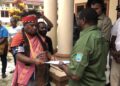 Deputy Chairperson I of LMA Nasawat, Marten Saflela, hands over the Indigenous community’s demands to Sarteis Yulian Sagrim, Head of the Watershed Management and Social Forestry Division at the Southwest Papua Environment, Forestry, and Land Agency, on Friday (22/5/2026). — Jubi/Gamaliel Kaliele